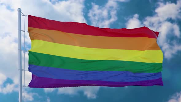 VideoHive Rainbow LGBT Flag Waving Against a Blue Sky 38993505